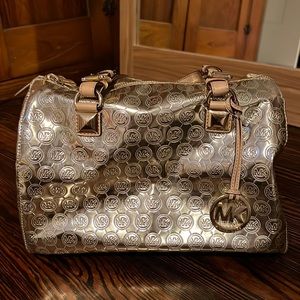 Michael Kors MK Shiny Gold Purse. Has some wear.